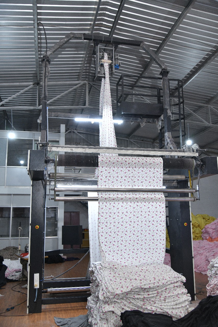 Tubular Knit Fabric Slit Opener Machine in Operation